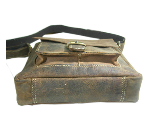 Brown leather bag with a buckle on a white background